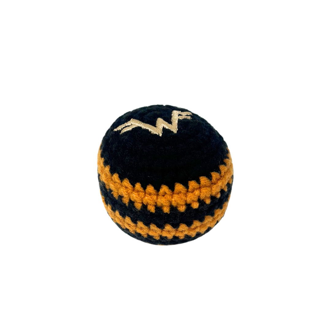 Black and orange crocheted dog toy with gold embroidered w logo in black and gold striped hacky sack design