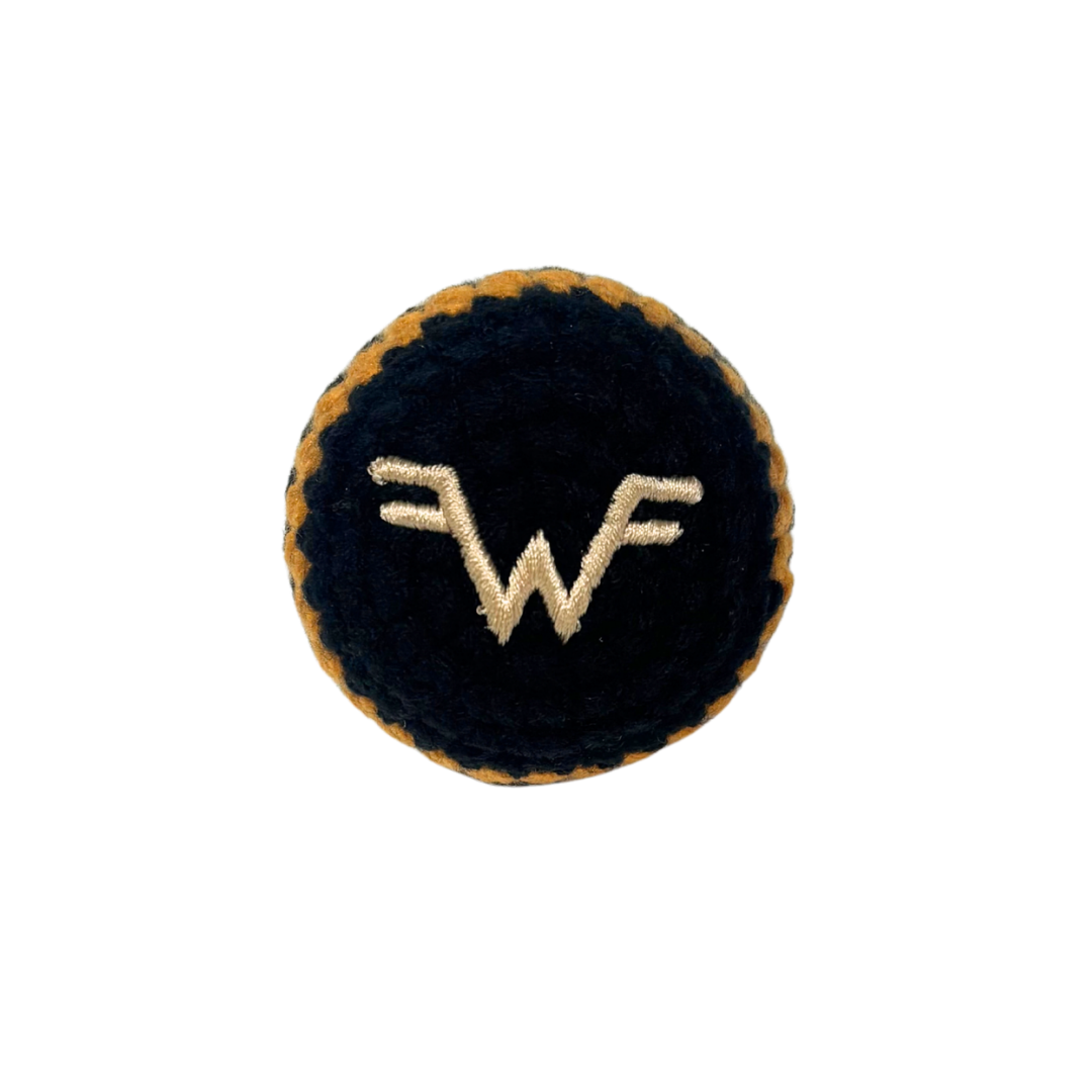 Dark blue velvet circular patch with gold embroidered wf logo on black and gold striped hacky sack