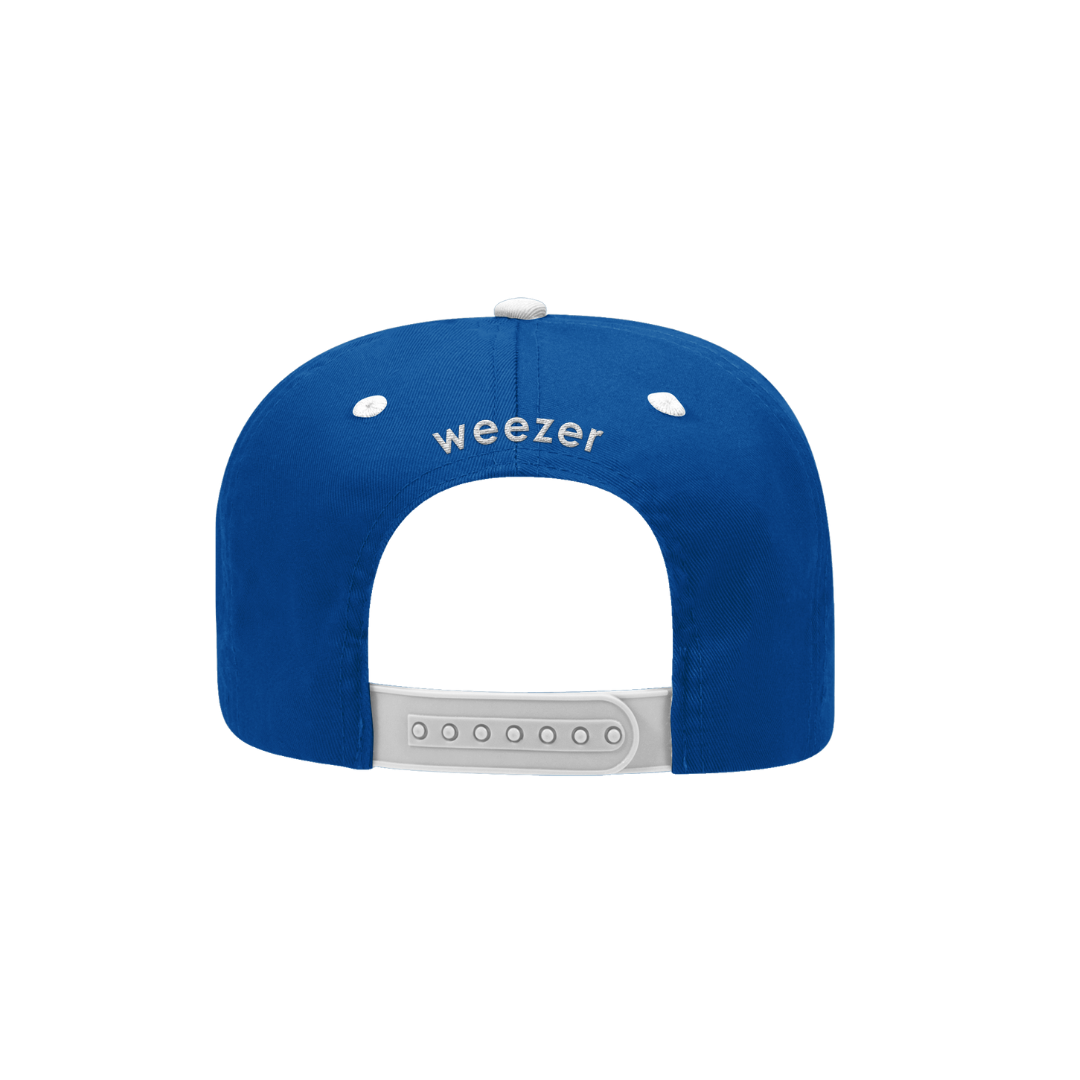 Blue snapback cap with white embroidered ’weezer’ logo and matching white button.