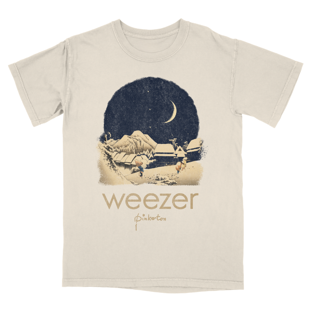 Cream-colored short-sleeved cotton t-shirt with vintage snowy village print and weezer pinkerton starry tee design