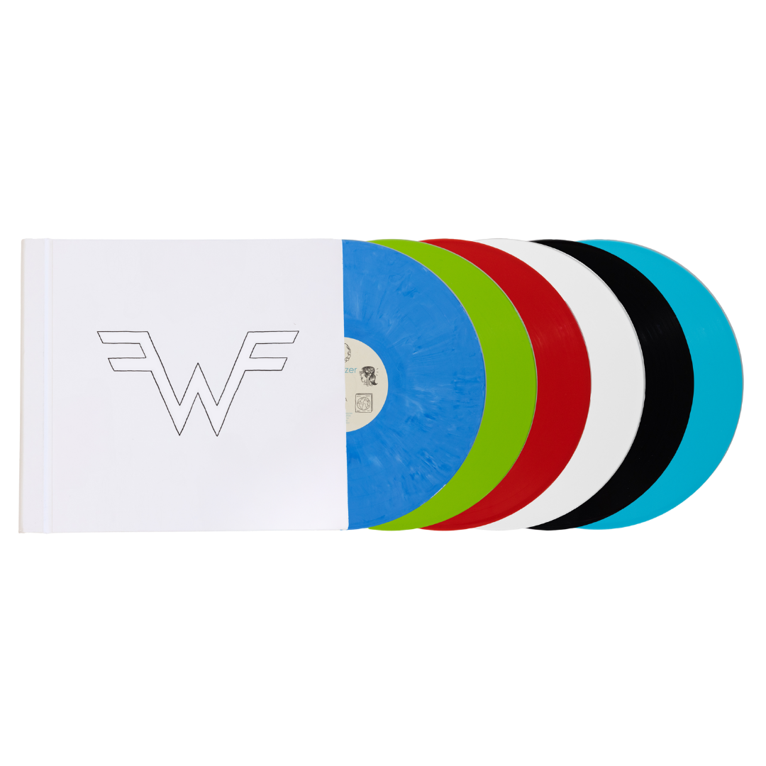 A vibrant multi-colored vinyl record set featuring five translucent discs in blue, green, red, white, and black, housed in a minimalist white sleeve with a stylized ’w’ logo.