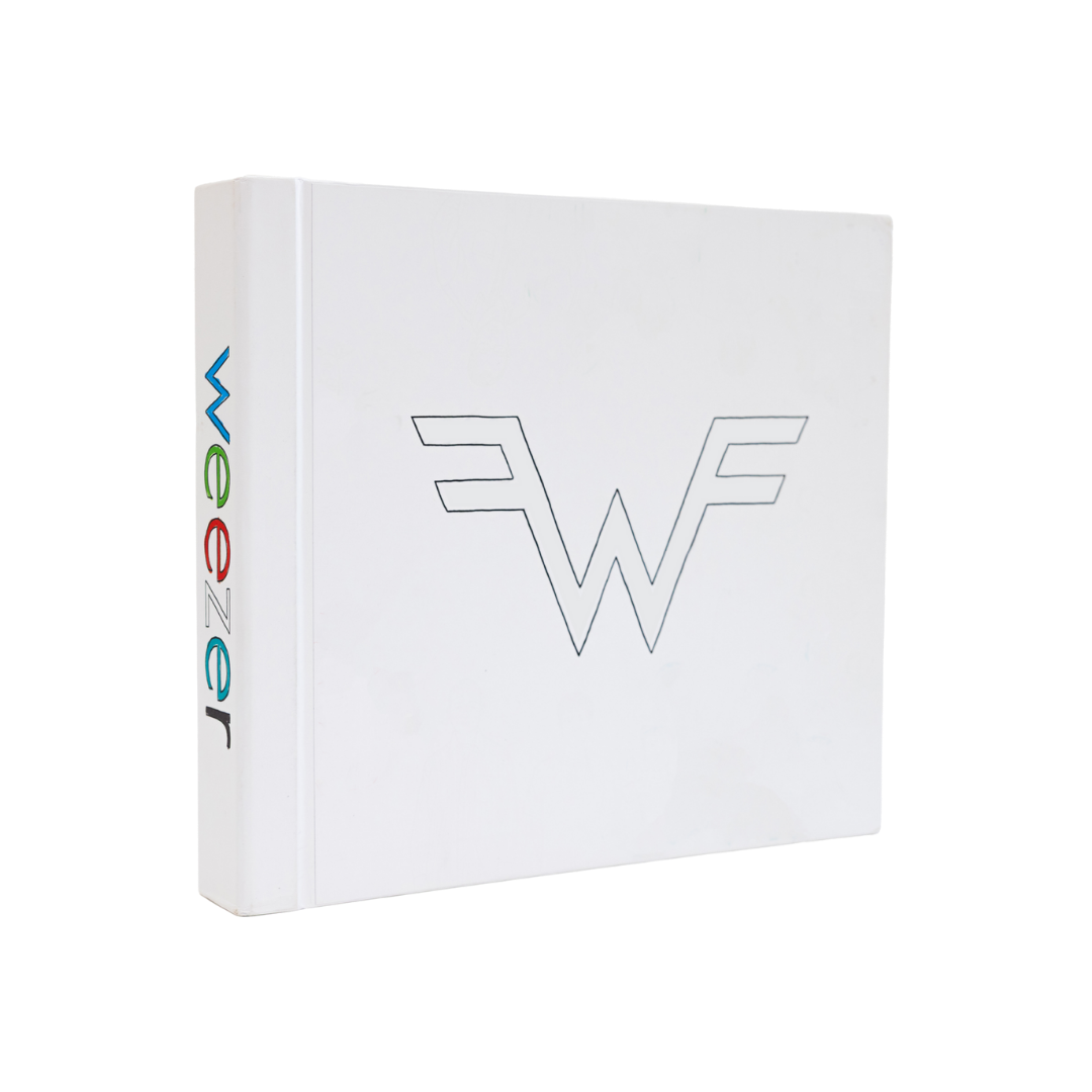 White wonder woman album cover with a minimalist black outline of the iconic ’w’ logo and colorful vertical lettering on the spine.