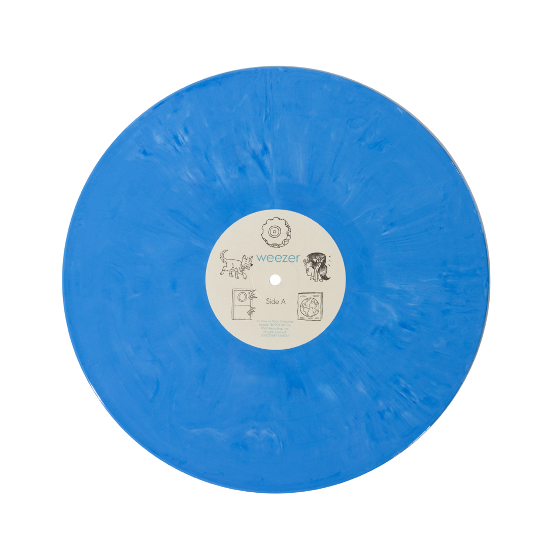 A vibrant blue translucent vinyl record with a white center label featuring the band name ’weezer’ and illustrations.