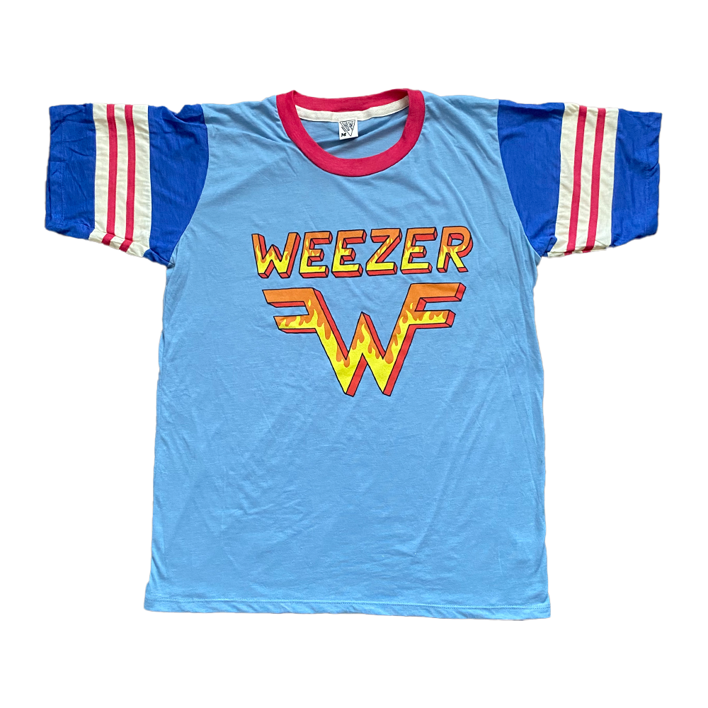 Light blue t-shirt with ’WEEZER’ logo and stylized W design on the front, featuring blue and white striped sleeves and a red collar.