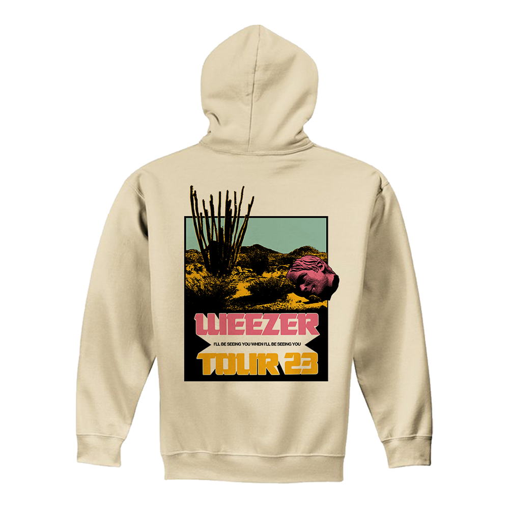 Beige hoodie with a desert landscape and ’Wheezer Tour 23’ graphic on the back.